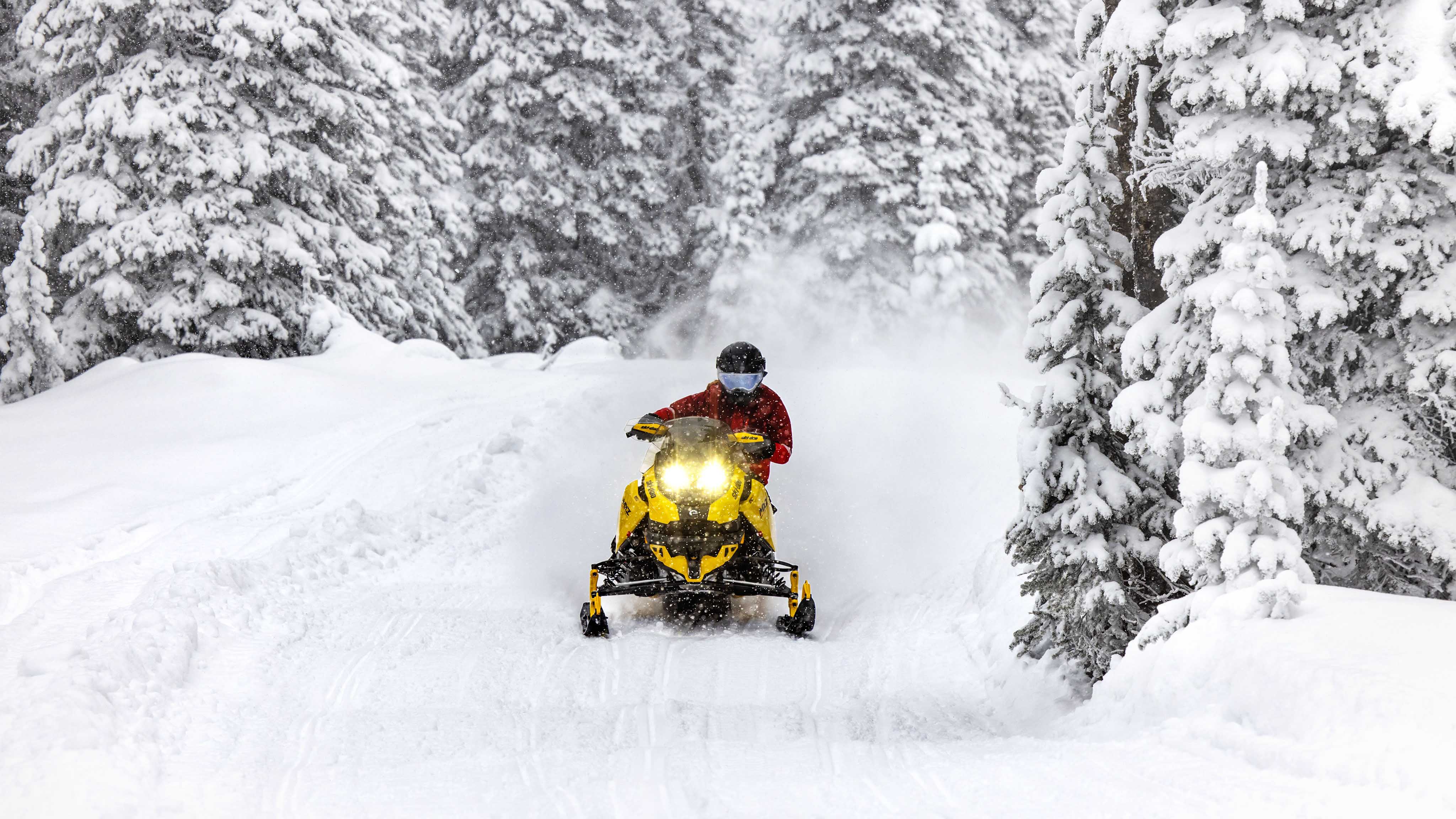 Man snowmobiling with the 2023 Ski-Doo MXZ