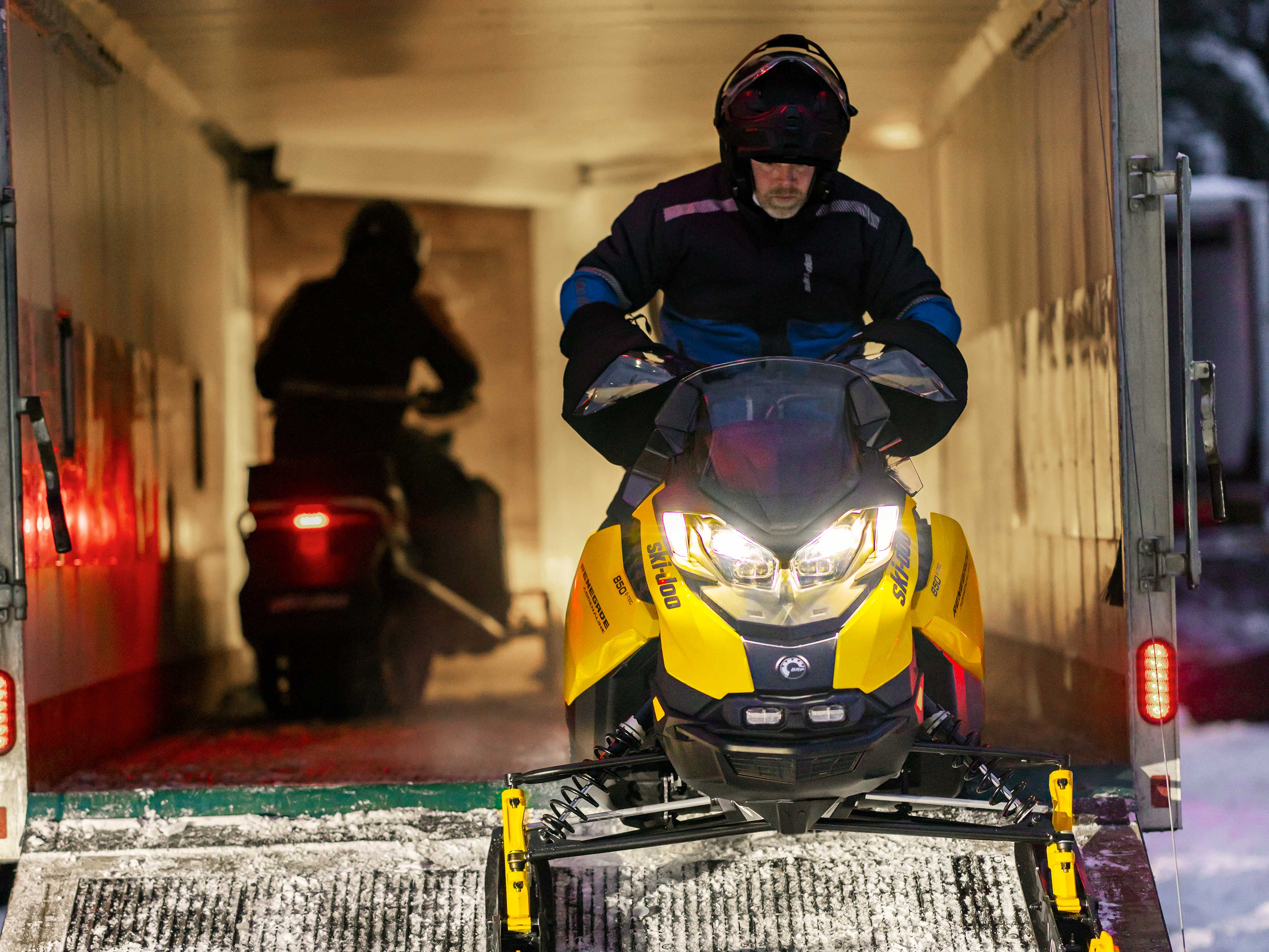 Two Ski-Doo Snowmobiles in a trailer