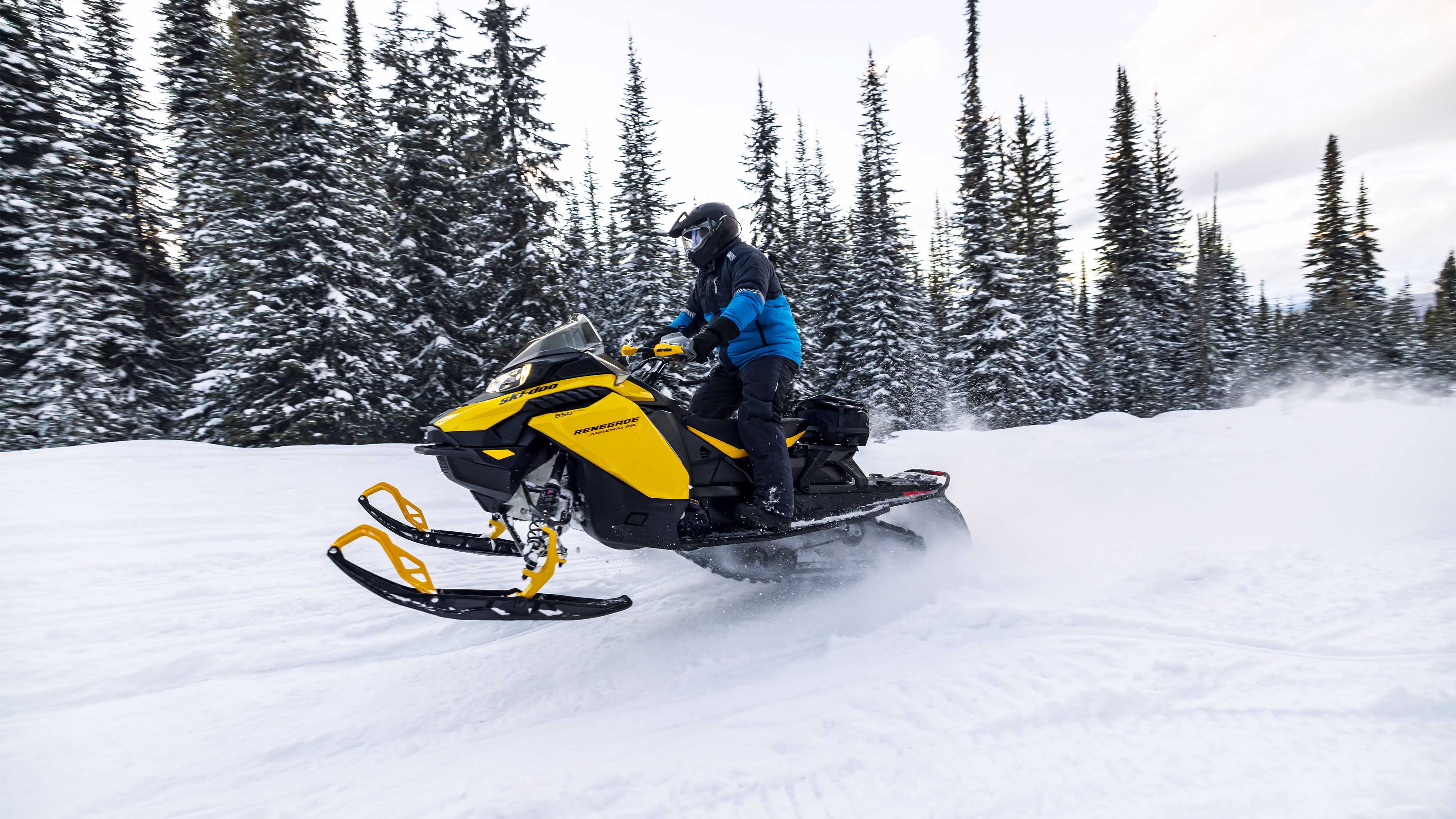 Man standing on his 2023 Ski-Doo Renegade 