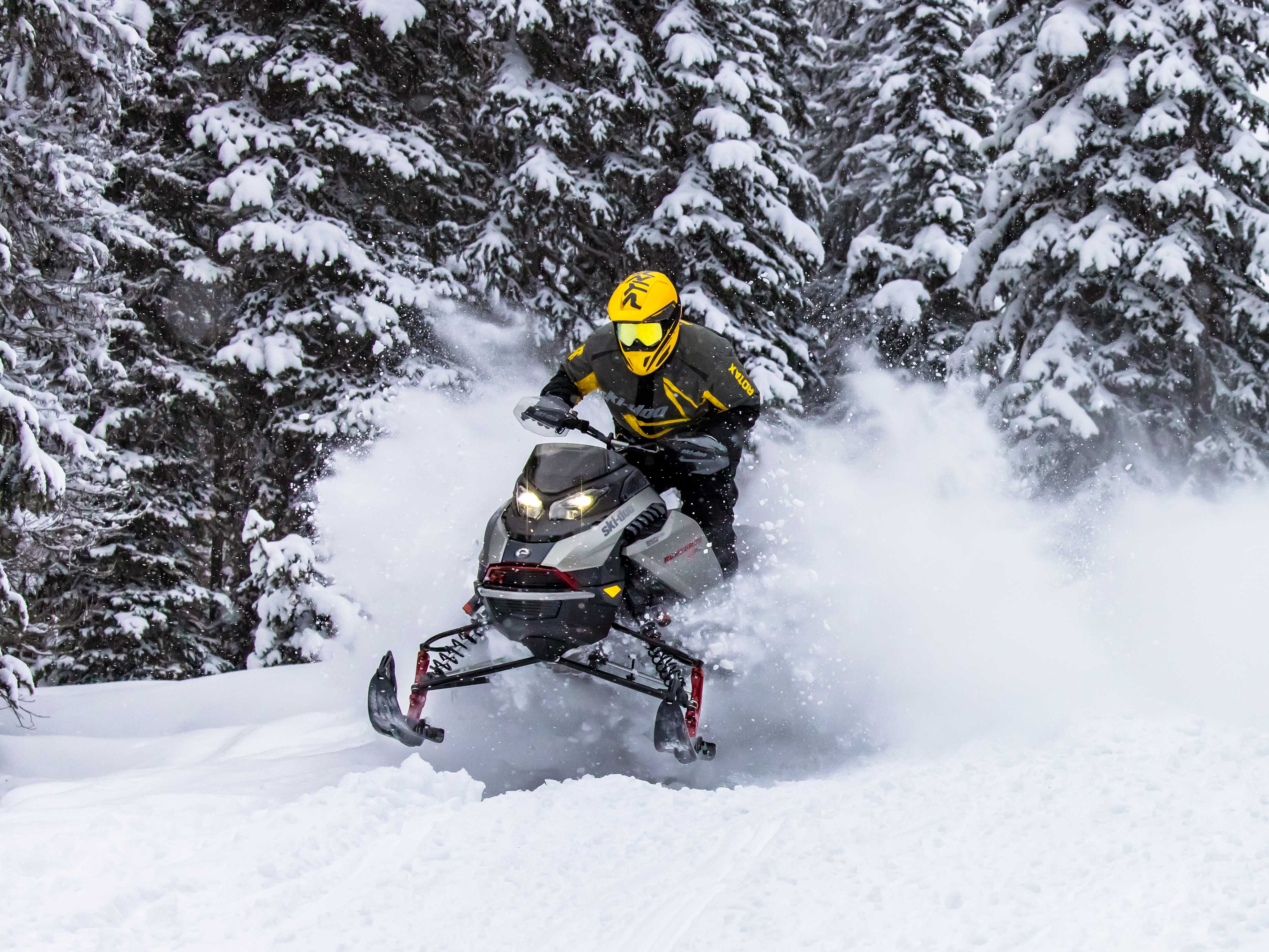 Man snowmobiling with the 2023 Ski-Doo Renegade