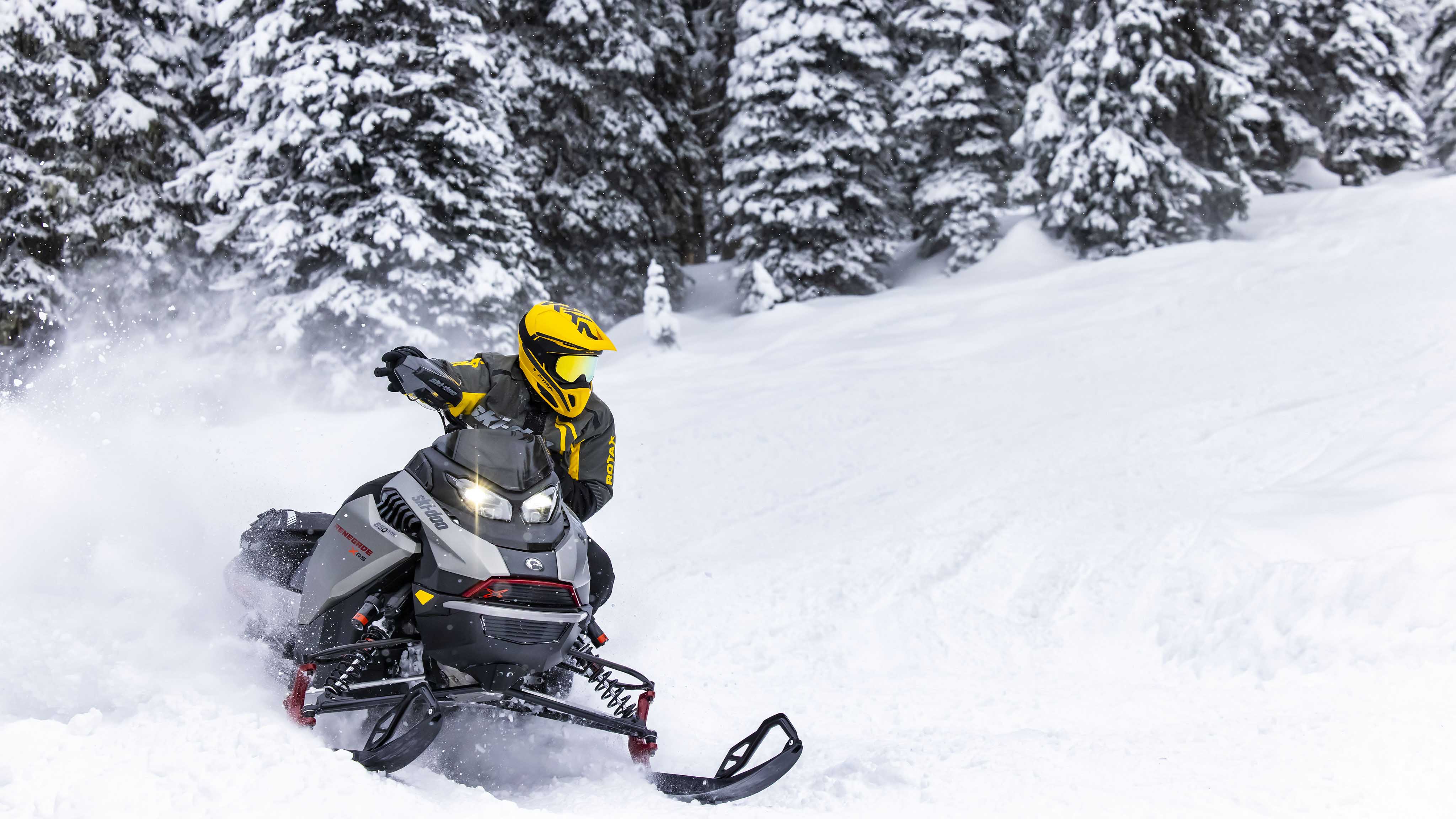 Man snowmobiling with the 2023 Ski-Doo Renegade