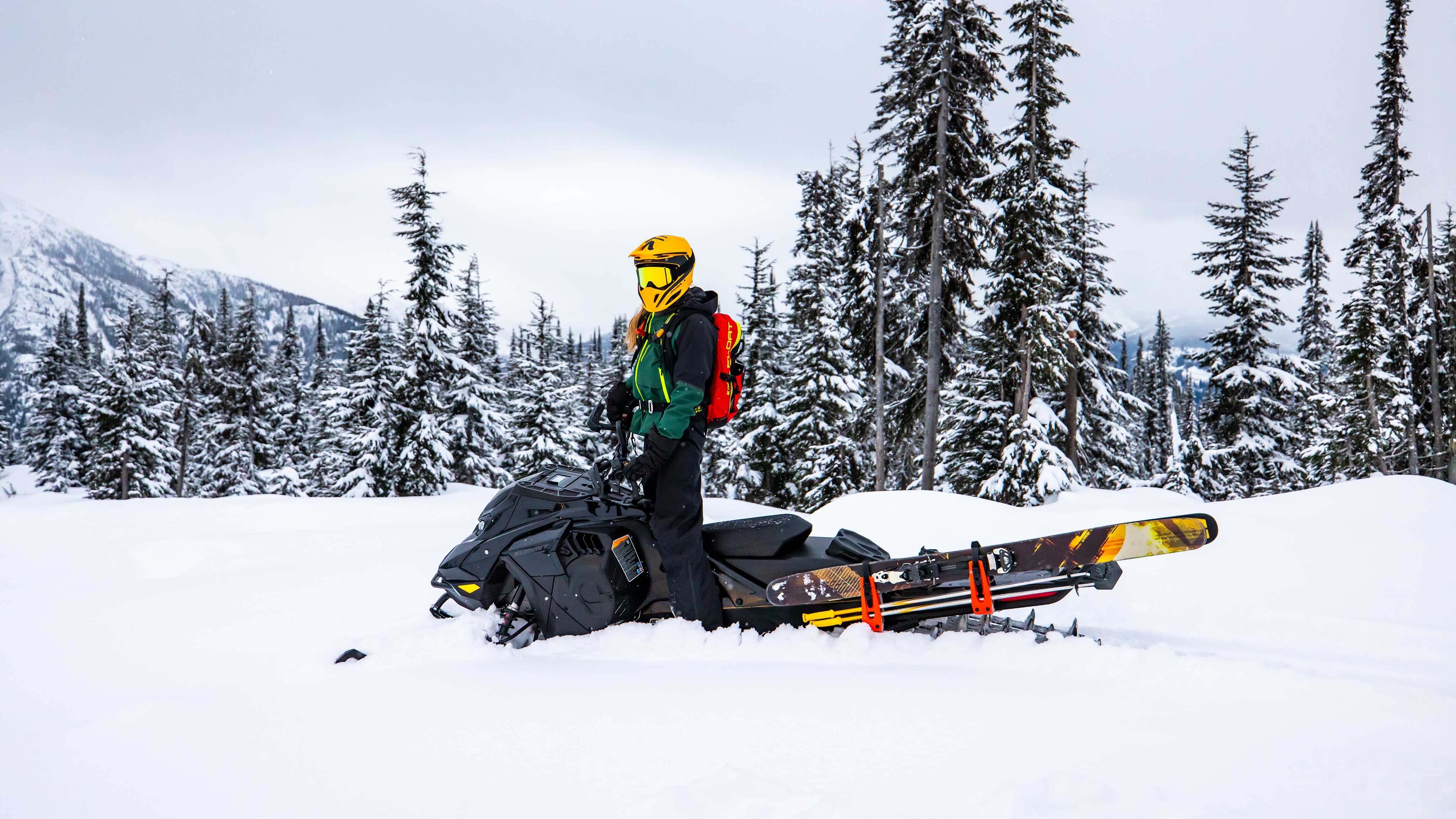 Woman on a Ski-Doo Summit Edge ready for sled-skiing 