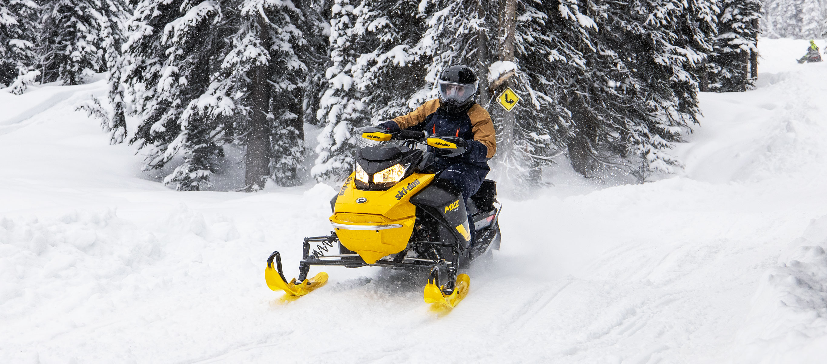 Man riding the new Ski-Doo MXZ Neo on a trail