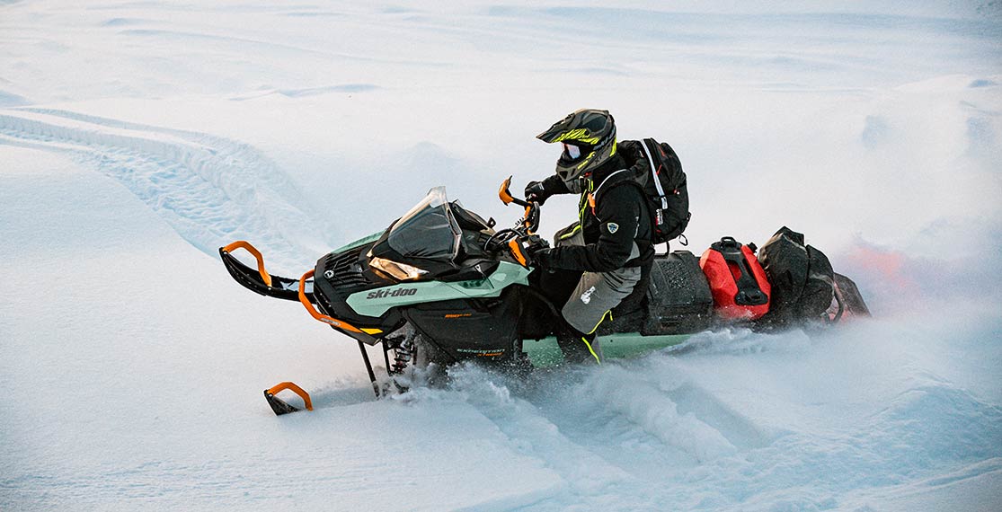 Man riding a Ski-Doo snowmobile